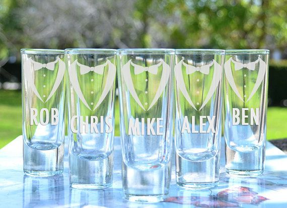 Shot glasses etched with names of groomsmen and tuxedo-themed art using Paykoc Imports' product customization designer